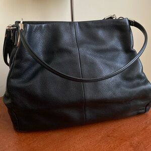 Coach purse. Very practical with multiple pouches and ultra soft black leather.